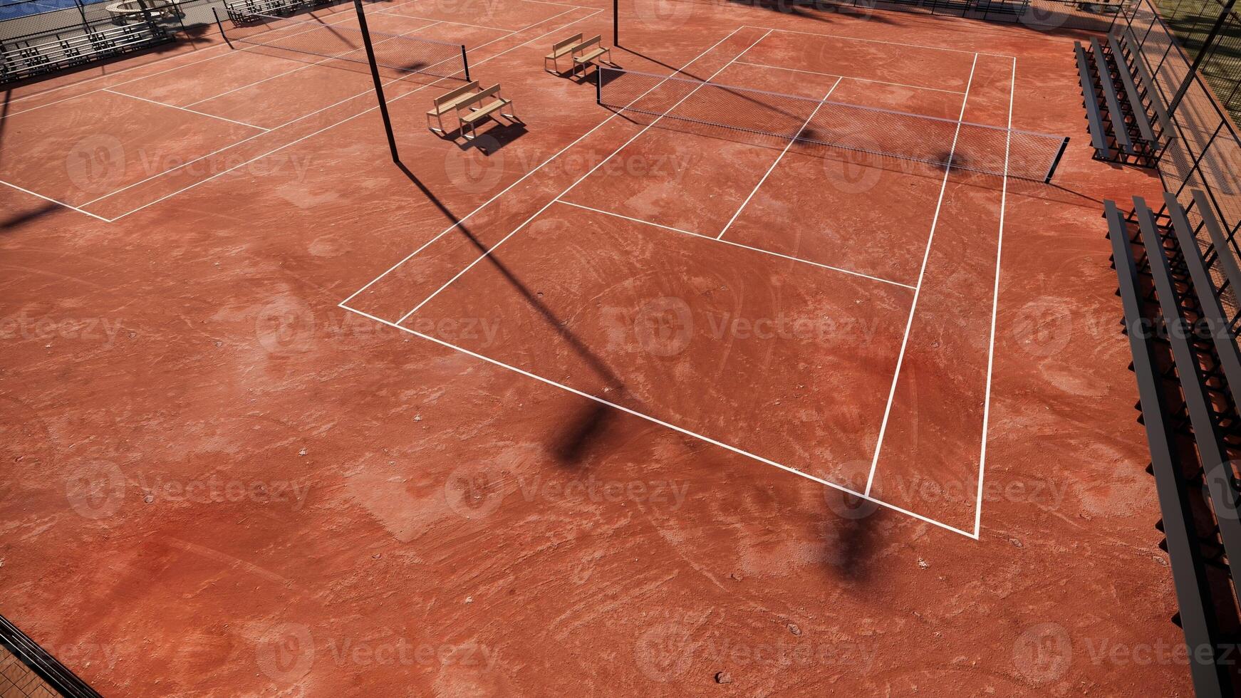 aerial view of tennis court with red clay surface include net, lights, spectator seats photo