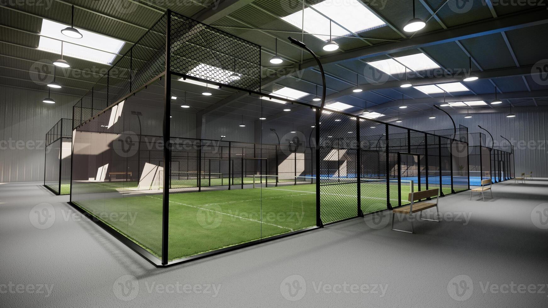 empty green and blue padel tennis courts inside a warehouse building. Located in the sports complex facility area. With lights on during the day photo