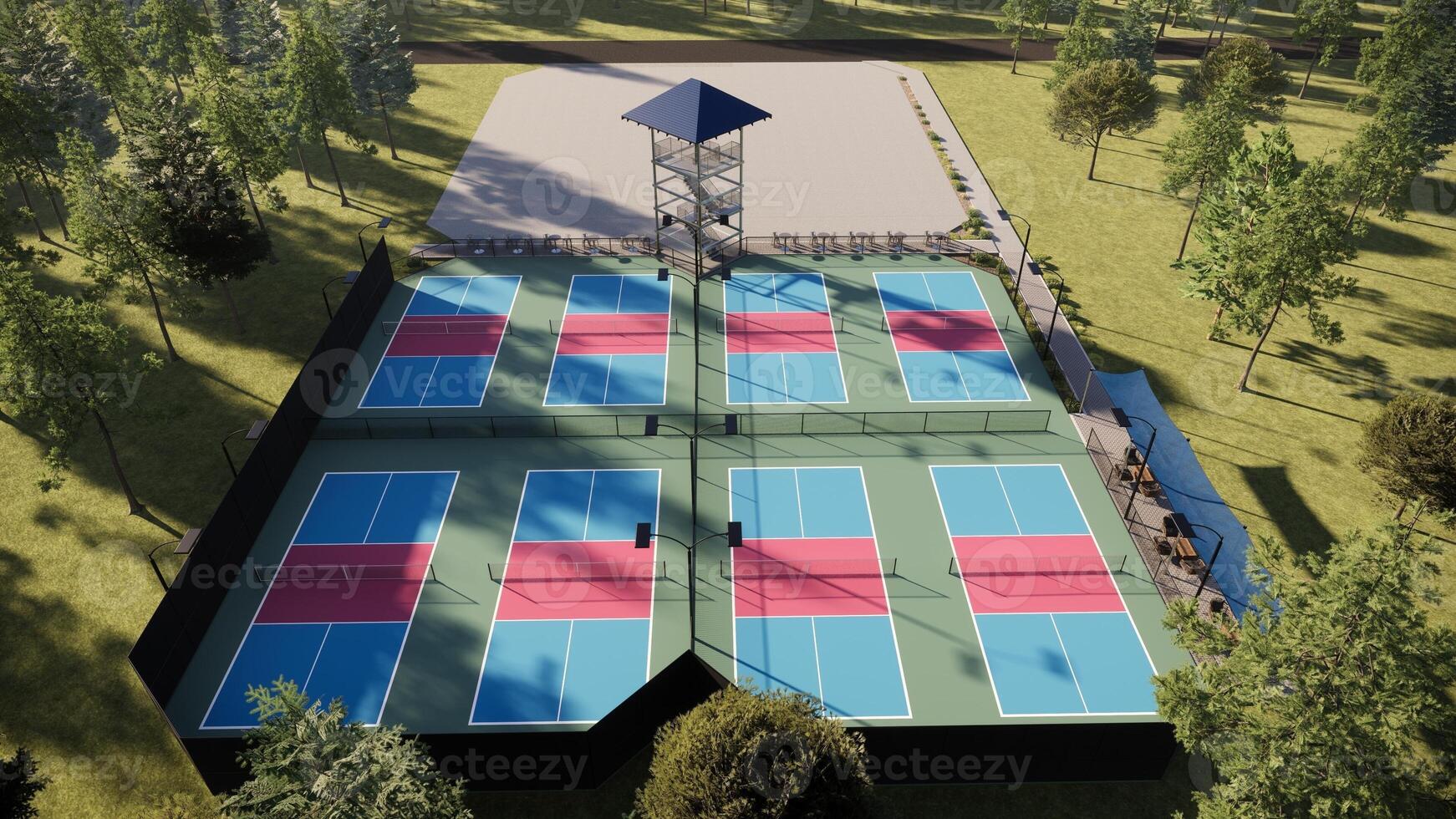 Aerial view l pickleball court with a blend of red, blue, and green colors, and equipped with lights, fencing, and seating photo