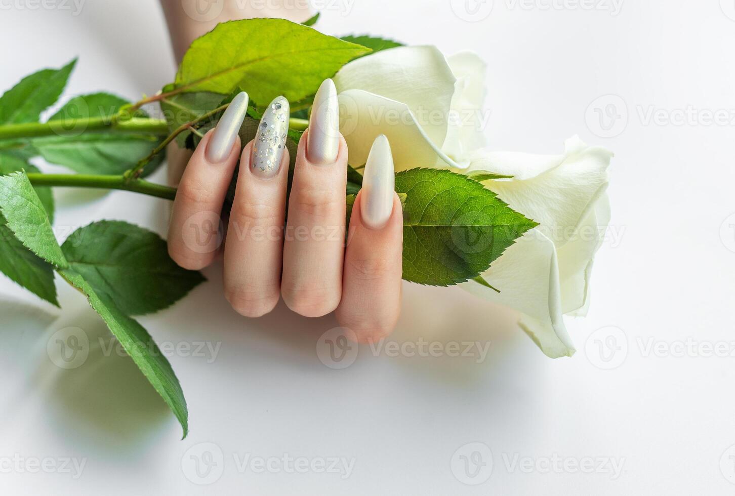 Female Hands with beautiful pearl manicure photo