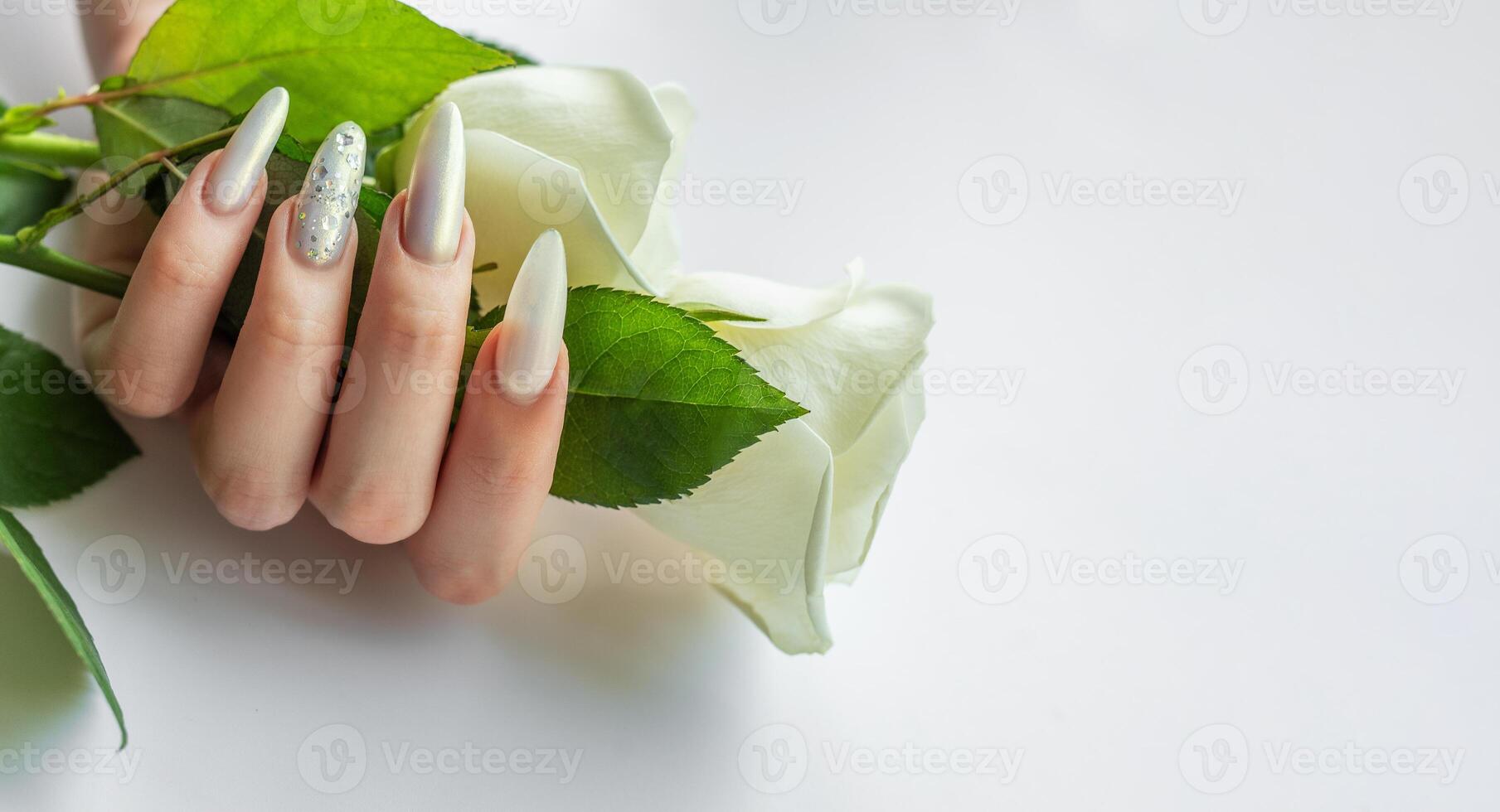 Female Hands with beautiful pearl manicure photo