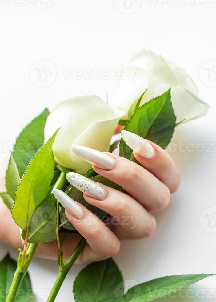 Female Hands with beautiful pearl manicure photo