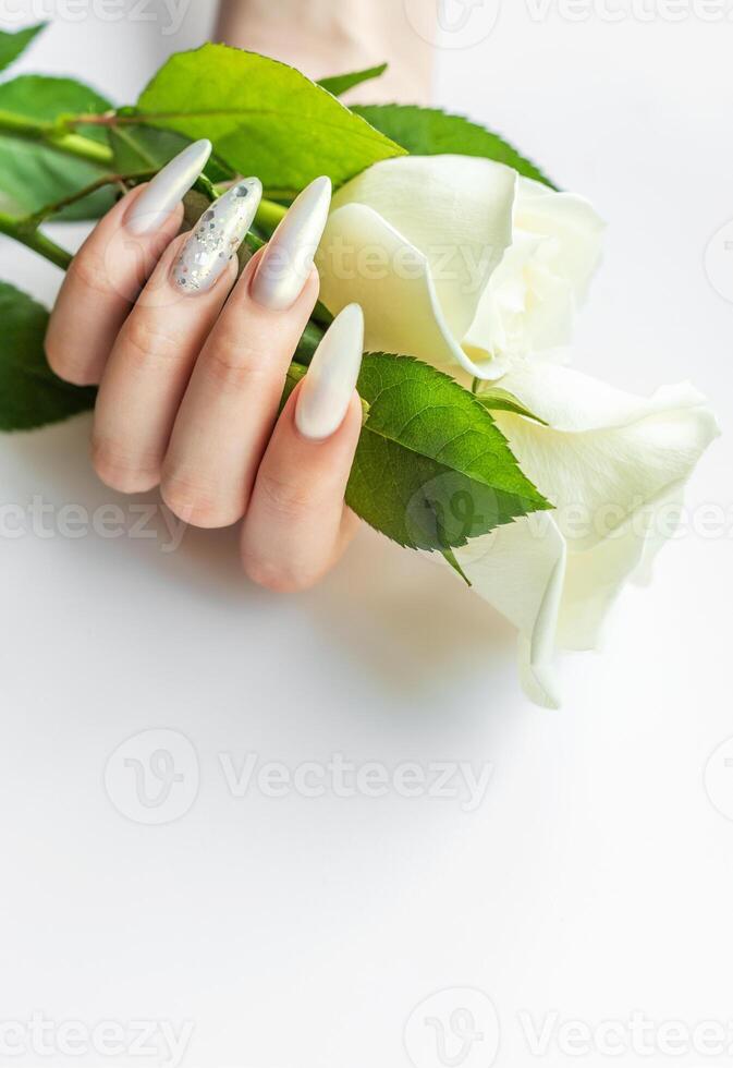 Female Hands with beautiful pearl manicure photo