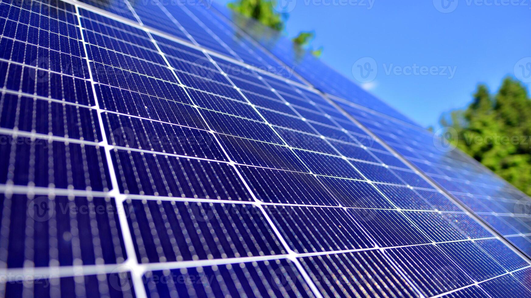 Group of solar panels on a blue sky. Concept of solar energy. photo