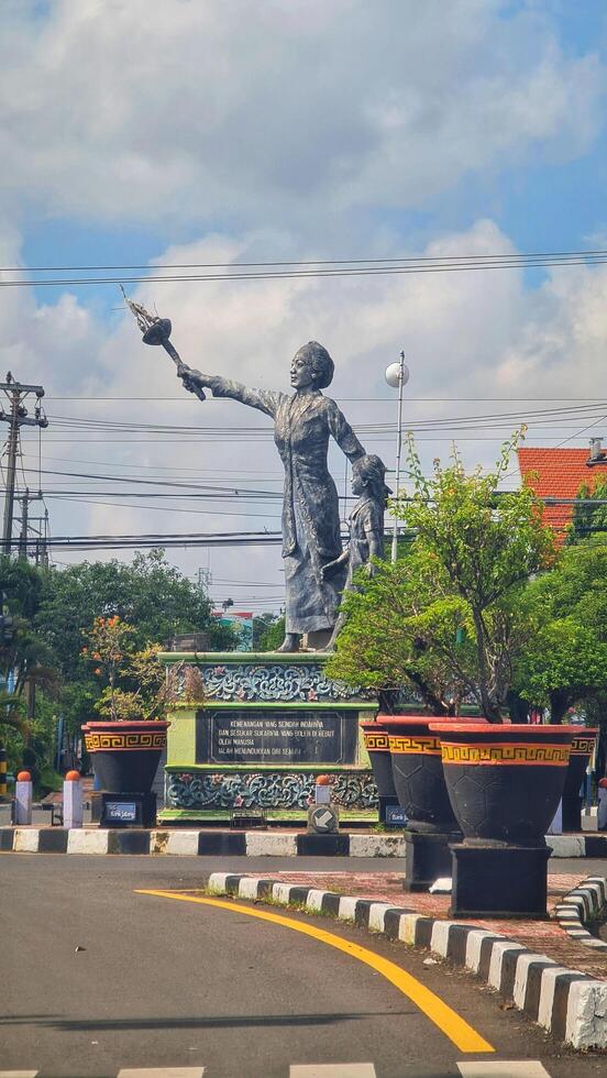 Jepara, Indonesia on January 21, 2024. A crossroads in Jepara where in the middle there is a statue of Our Lady Kartini. photo