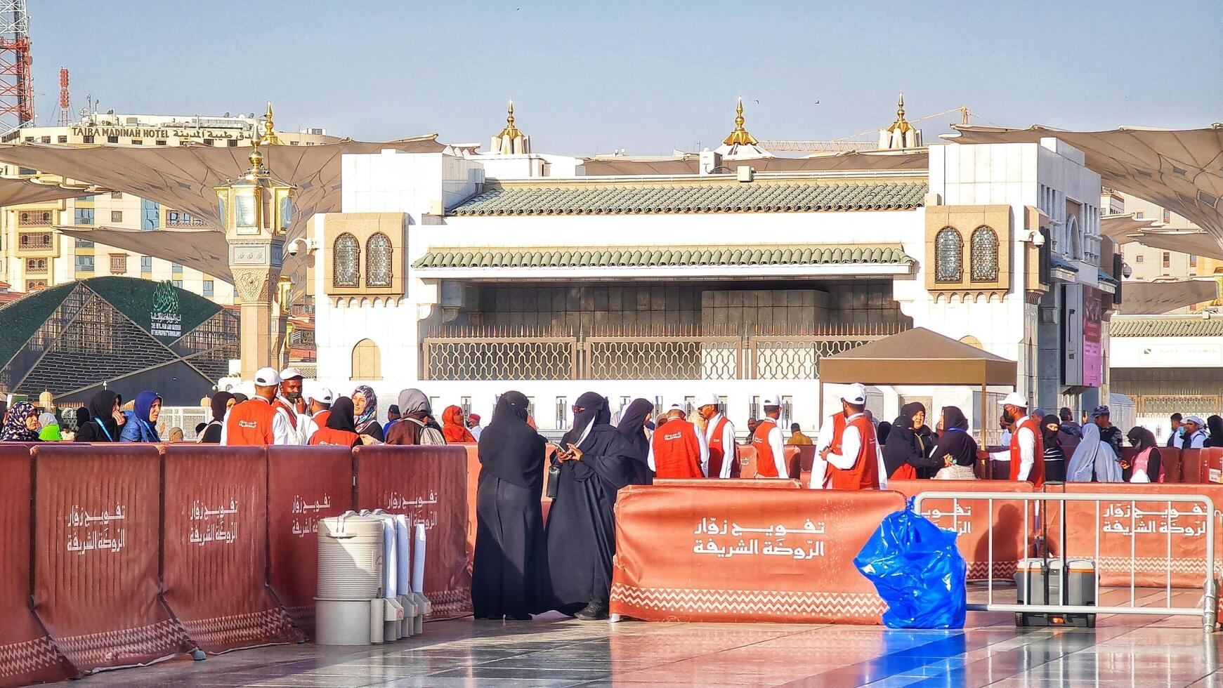 Medina, Saudi Arabia on March 1, 2024. Queues of female Umrah pilgrims from all over the world line up to enter Raudhah or the Tomb of the Prophet Muhammad. Gate 37. Use a registered Tasreh or Nusuk. photo