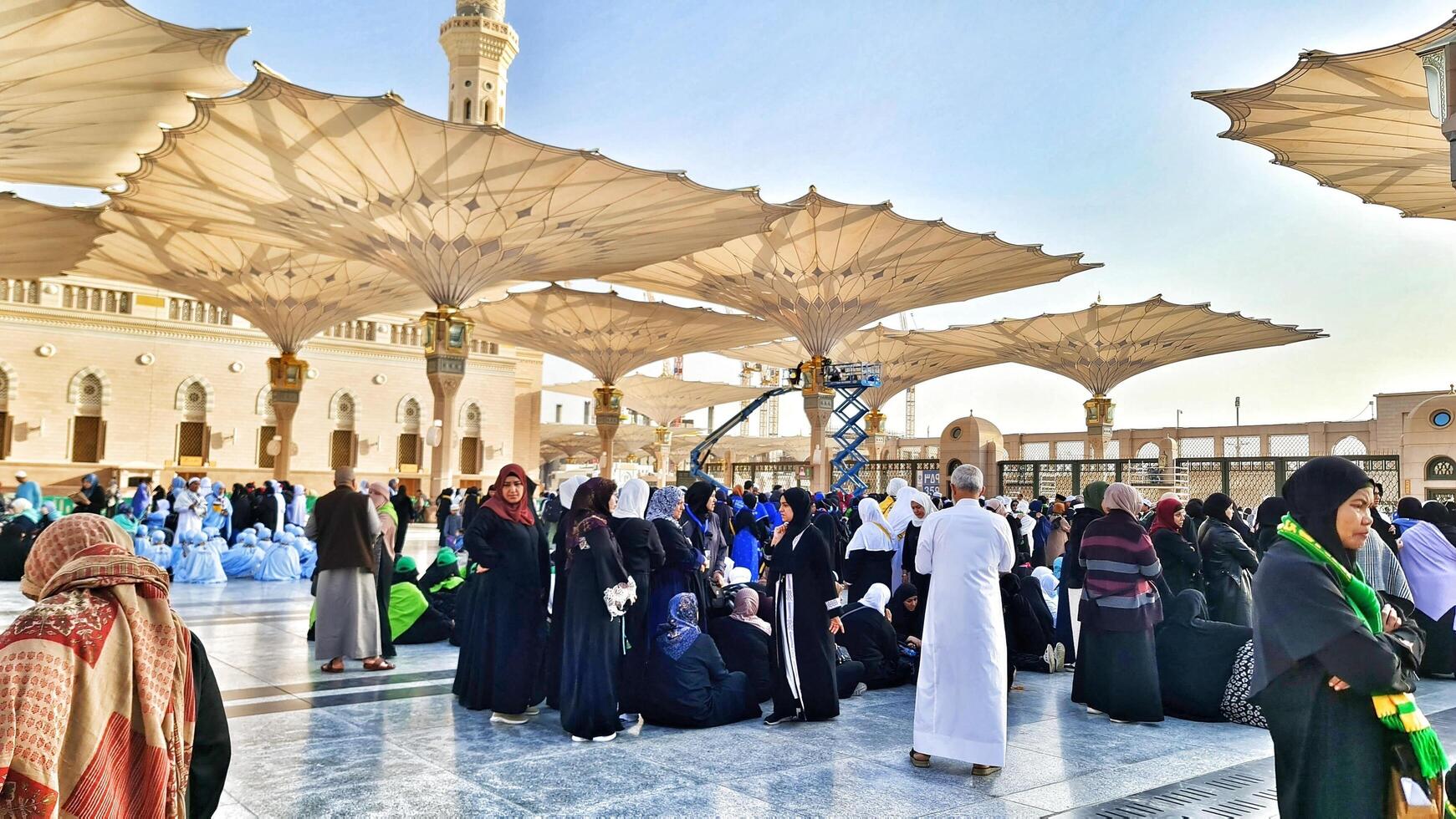 Medina, Saudi Arabia on March 1, 2024. Queues of female Umrah pilgrims from all over the world line up to enter Raudhah or the Tomb of the Prophet Muhammad. Gate 37. Use a registered Tasreh or Nusuk. photo
