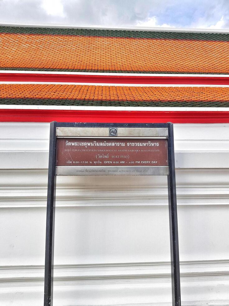Bangkok, Thailand on July 22 2023. Information board regarding the opening hours of Wat Phra Chettuphon Wimon Mangkhlaram Ratchaworamahawihan photo