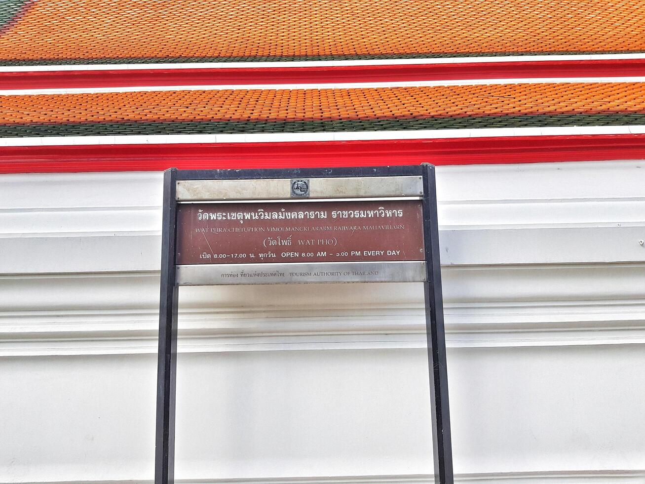 Bangkok, Thailand on July 22 2023. Information board regarding the opening hours of Wat Phra Chettuphon Wimon Mangkhlaram Ratchaworamahawihan photo