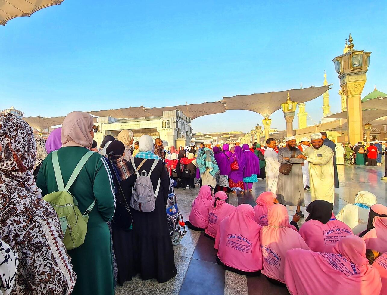Medina, Saudi Arabia on March 1, 2024. Queues of female Umrah pilgrims from all over the world line up to enter Raudhah photo
