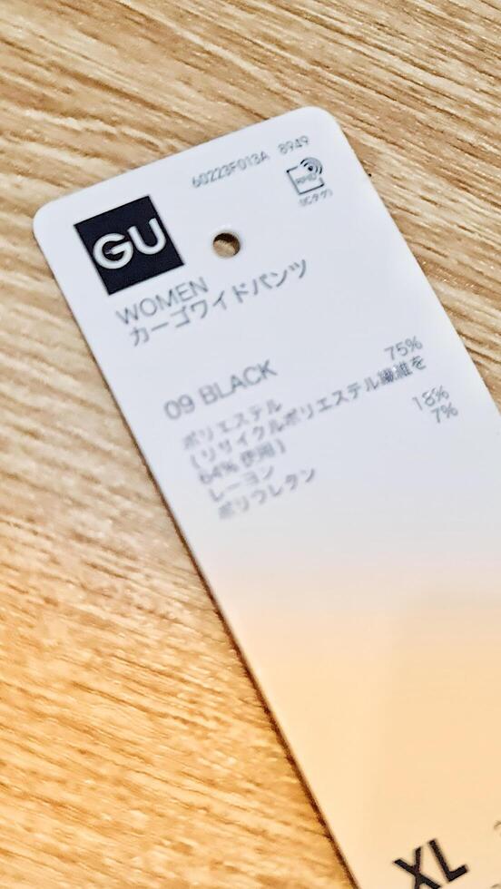 Tokyo, Japan on October 2, 2023. A GU brand clothing tag. photo