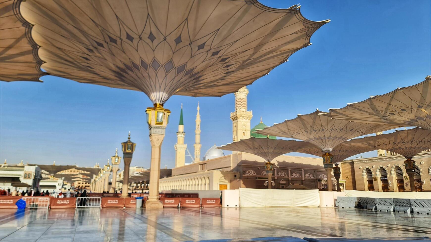 Medina, Saudi Arabia on March 2, 2024. Point of view of an Umrah or Hajj pilgrim walking in the courtyard of the Nabawi Mosque photo