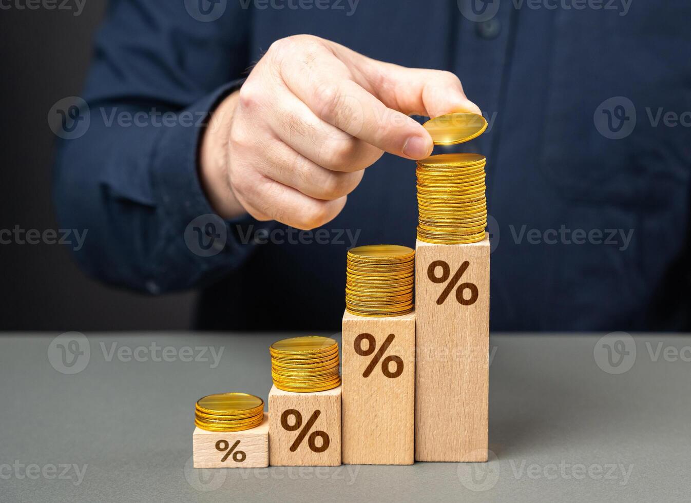 Deposits and savings. A businessman makes money on deposits and interest. Achieving a high return on investment signifies successful financial endeavors. Rising interest rates photo