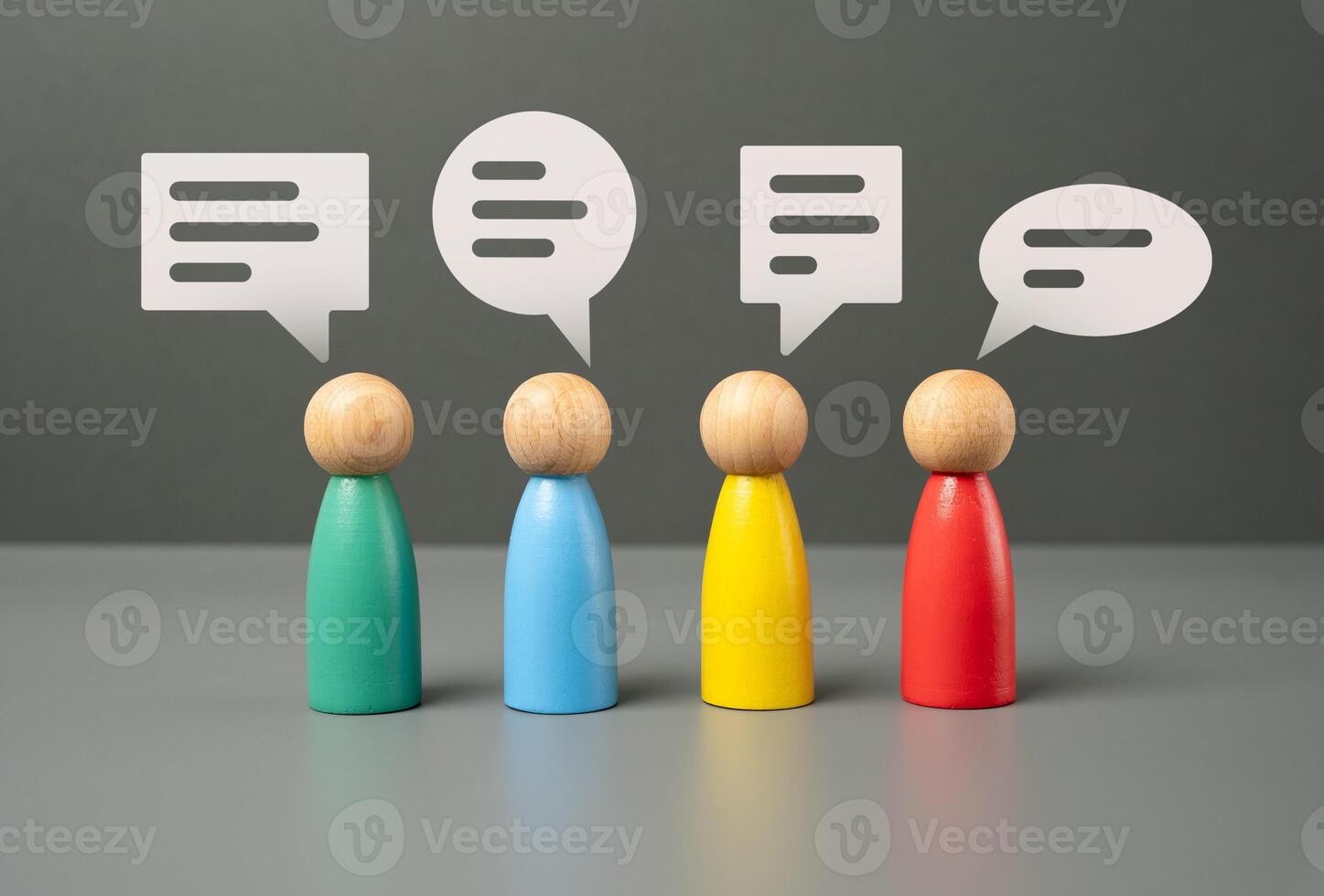 People communicate. Figures of people and speech bubbles. Unity and teamwork. Contact, communication. Exchange of opinions and experiences. photo