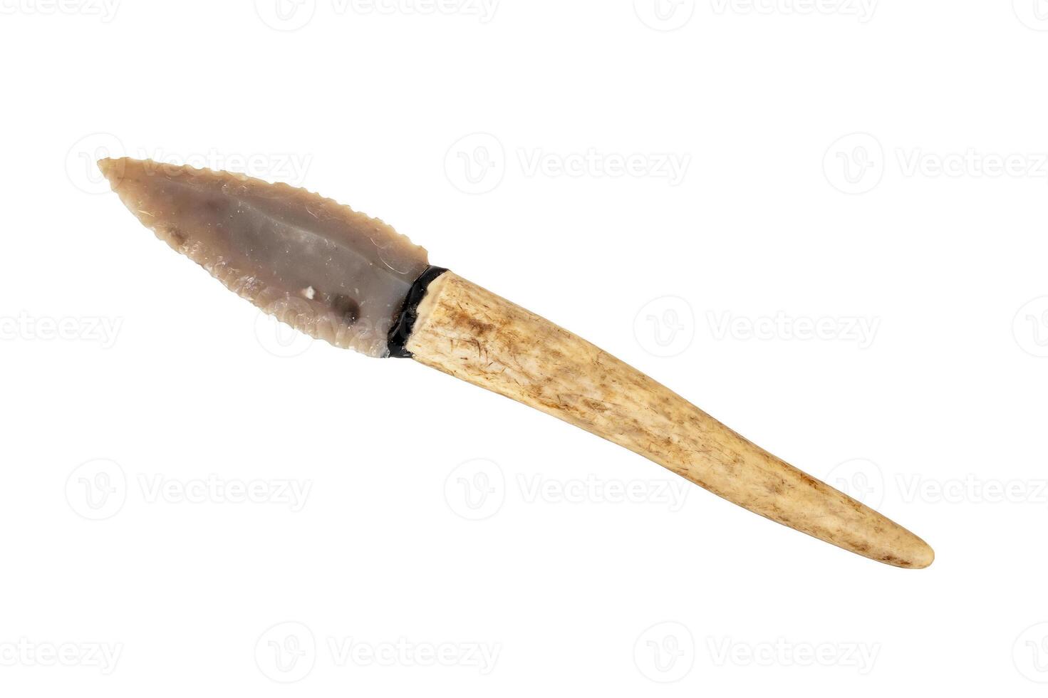 flint knife - stone age tool - leaf blade in deer antler isolated on white background photo