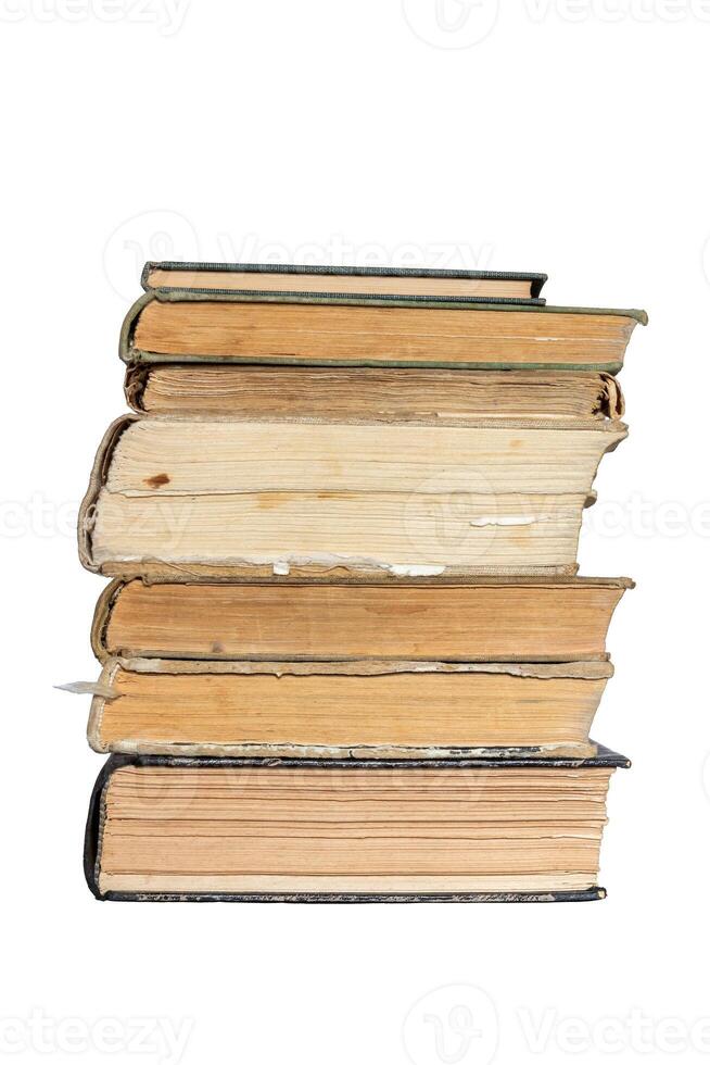 bottom view of a book stack - page edges of an old closed hardcover books stacked, isolated on white with clipping path photo