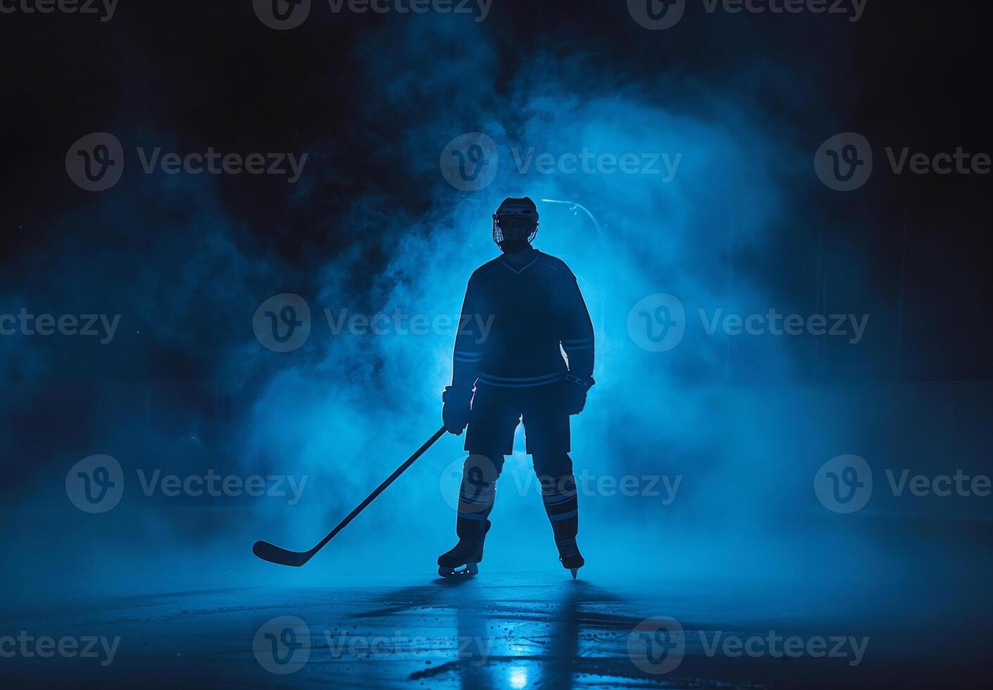 Silhouette of a hockey player standing on an ice rink, surrounded by blue mist, ready for action in a dramatic atmosphere. photo