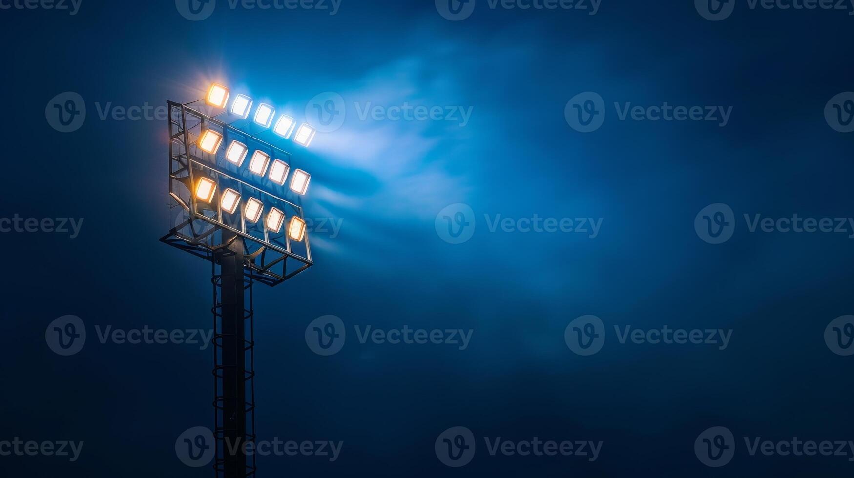 Photo of A stadium light on an empty dark blue background