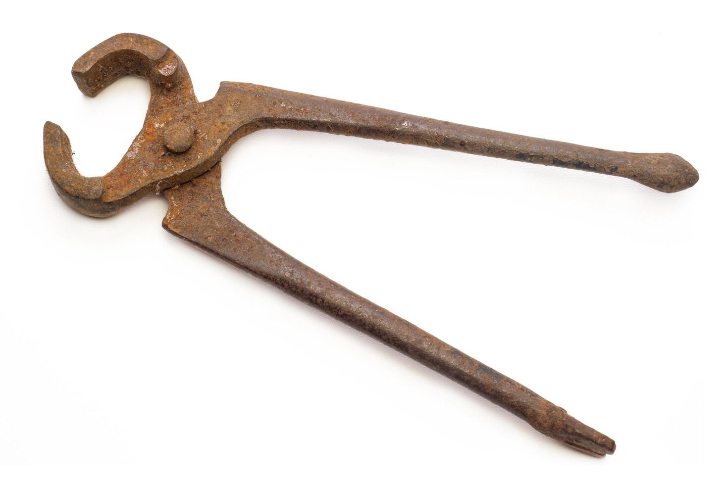 Old rusty pliers, isolated on white background photo