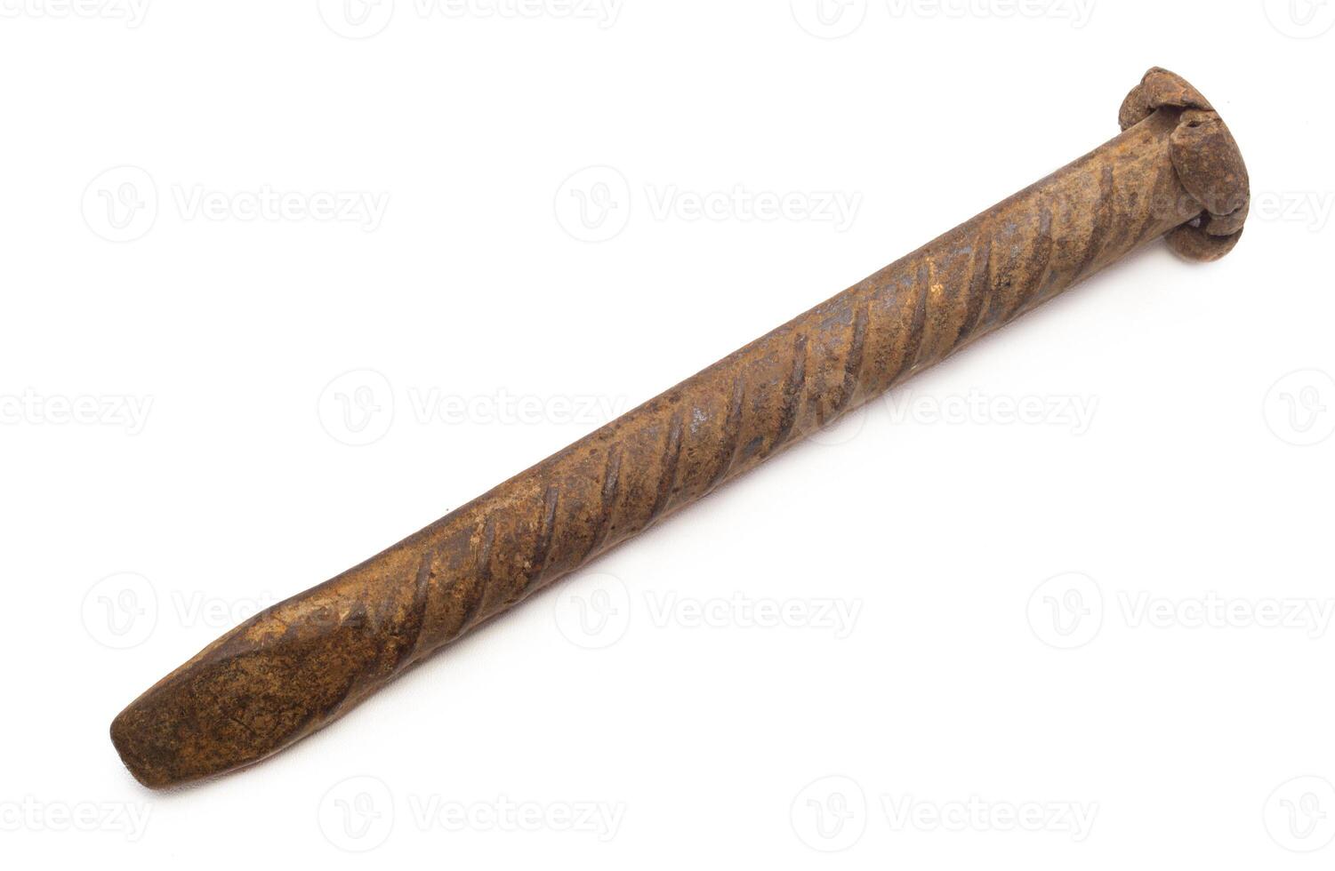 Rusty nail close up, isolated on white background photo
