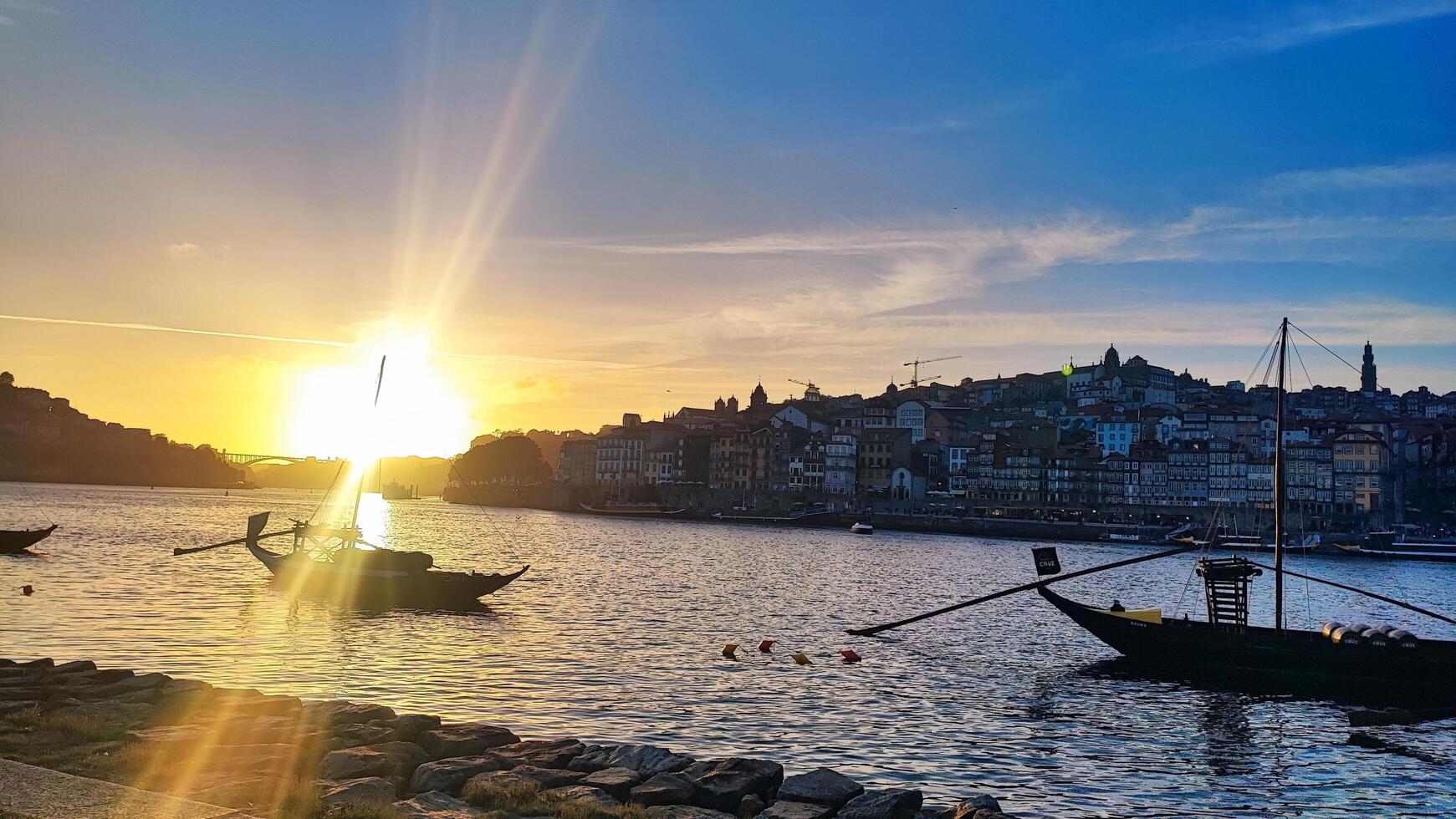 PORTO, PORTUGAL - JUNE 20, 2024. Panorama of the Douro River and the old town of Porto during sunset with a view of the yachts. photo