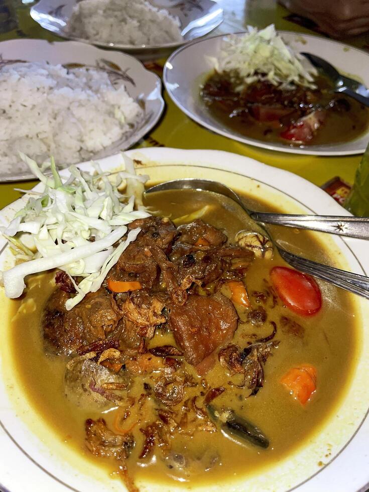 Indonesian food. Tongseng Ayam or Chicken Tongseng is a traditional Indonesian dish in the form of a savory meat soup with coconut milk and can be spicy or sweet photo