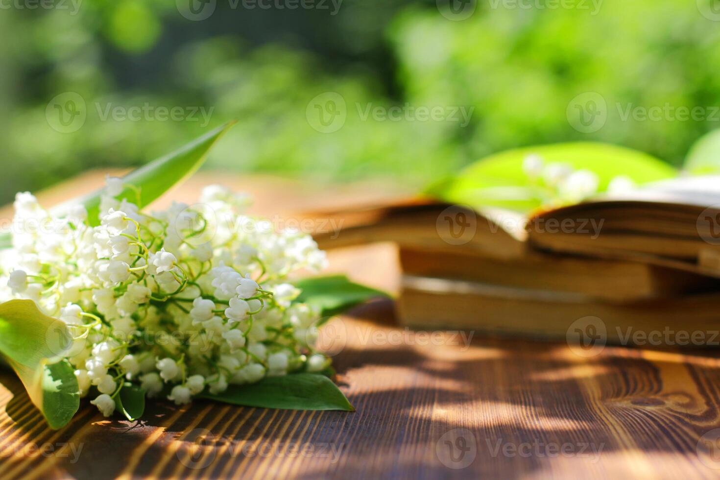 Closeup lily of the valley blossoms in selective focus, natural light. Delicate bouquet of lilies of the valley photo