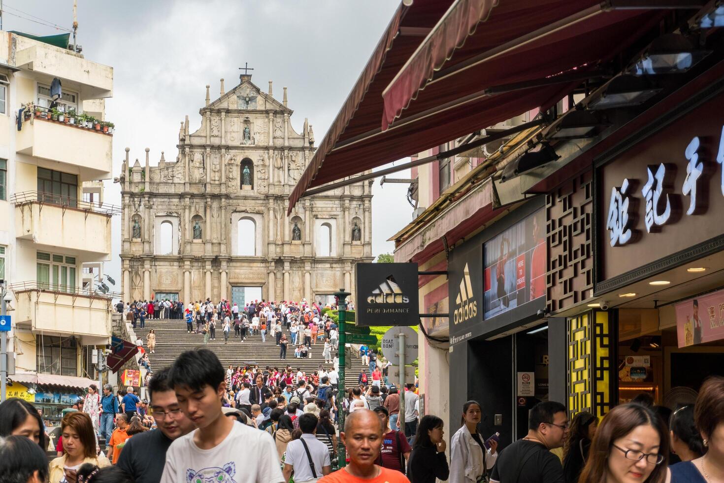 Macao, March 29, 2019-People visiting the Ruins of St. Paul's Cathedral in Macau on a cloudy day photo