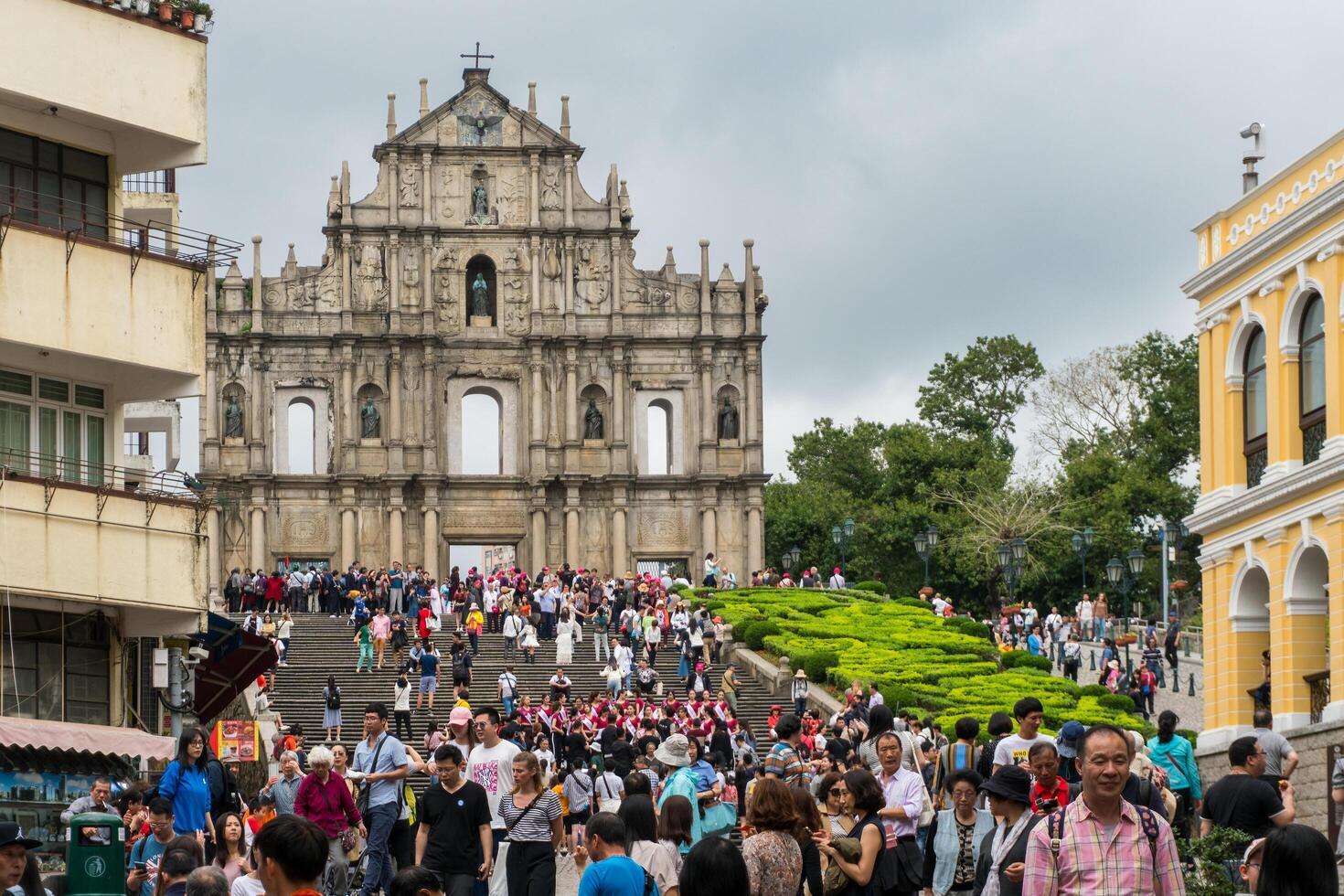 Macao, March 29, 2019-People visiting the Ruins of St. Paul's Cathedral in Macau on a cloudy day photo