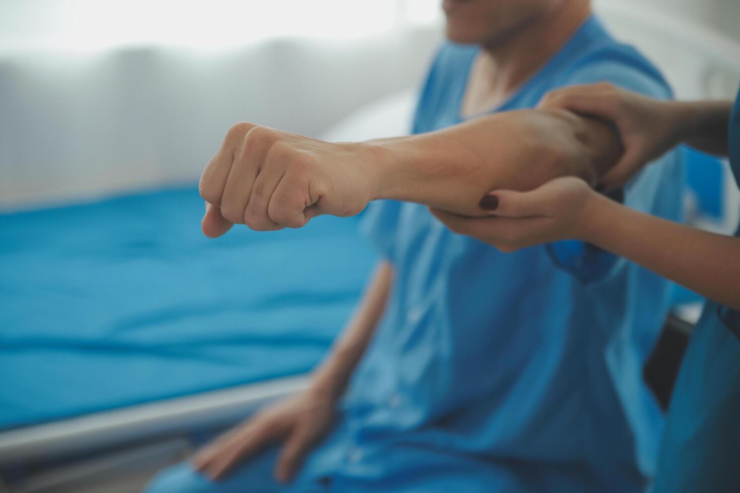 Physiotherapist man giving exercise with dumbbell treatment About Arm and Shoulder of athlete male patient Physical therapy concept photo