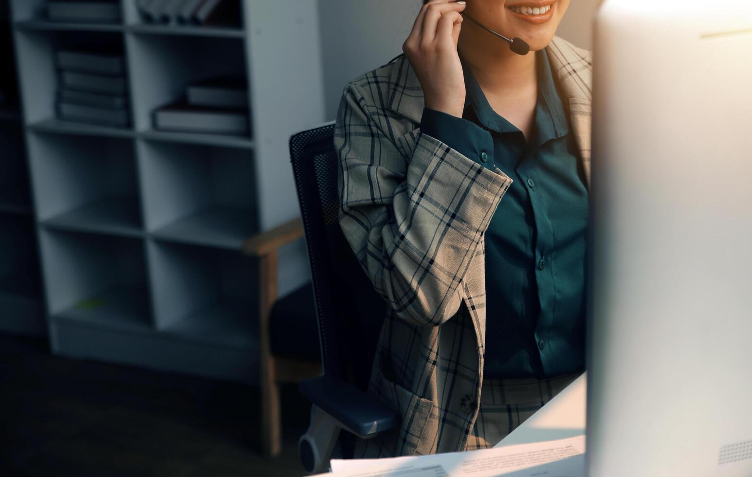 Call center, computer and business with woman in office for customer service, technical support and advice. Technology, contact us and communication with employee operator in help desk agency photo