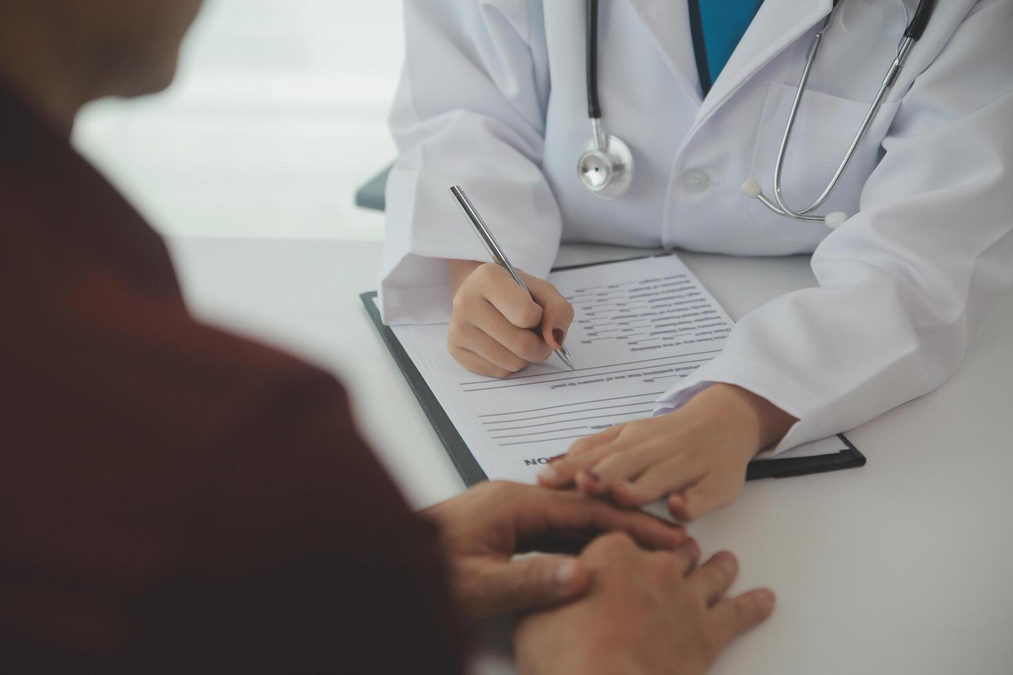 Female doctors shake hands with patients encouraging each other To offer love, concern, and encouragement while checking the patient's health. Concept Health care and Social Security photo