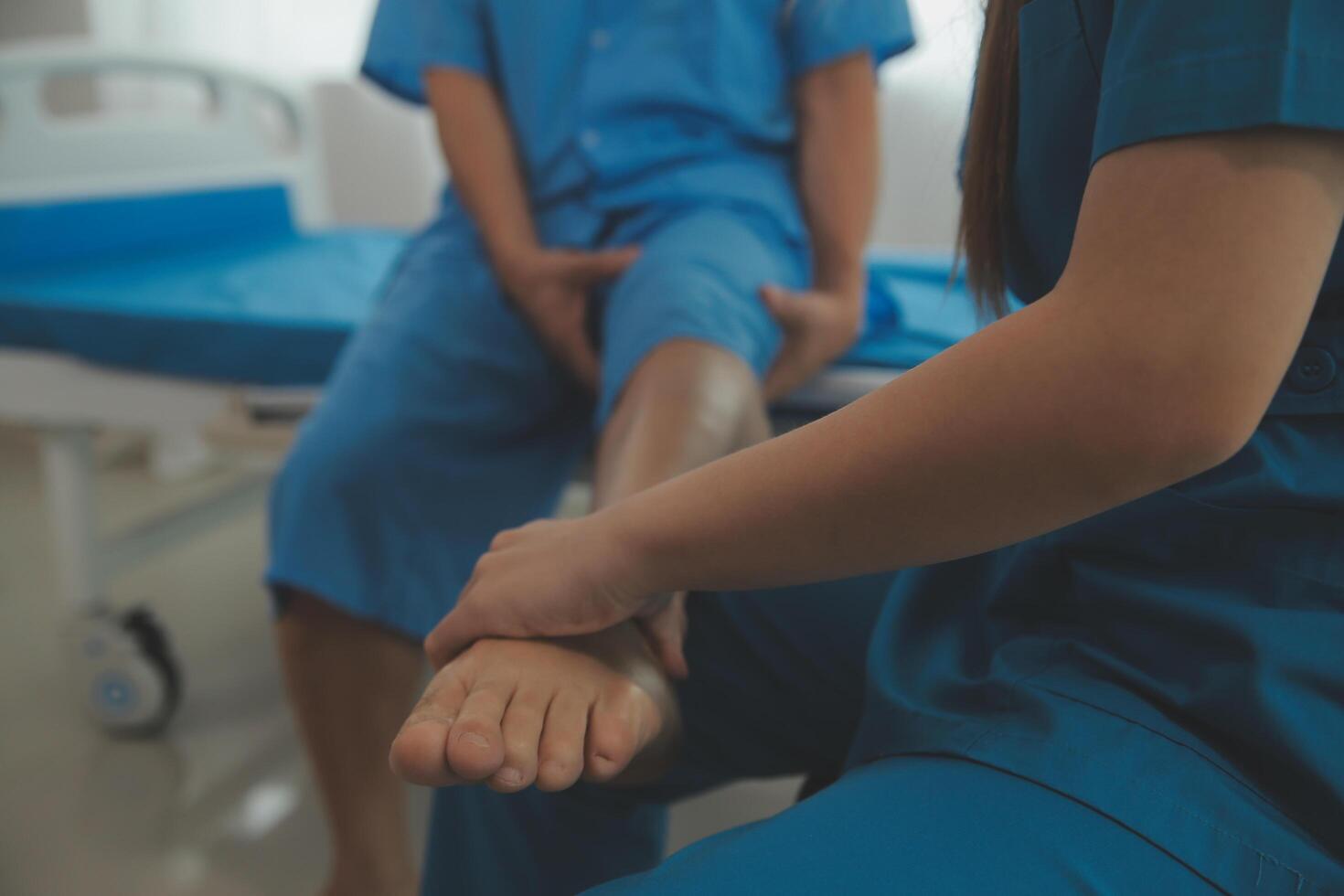 Physical therapists work with patients in close-up clinics. The concept of rehabilitation of physical health, the doctor gives advice to the patient. Ankle problems and muscle injuries photo