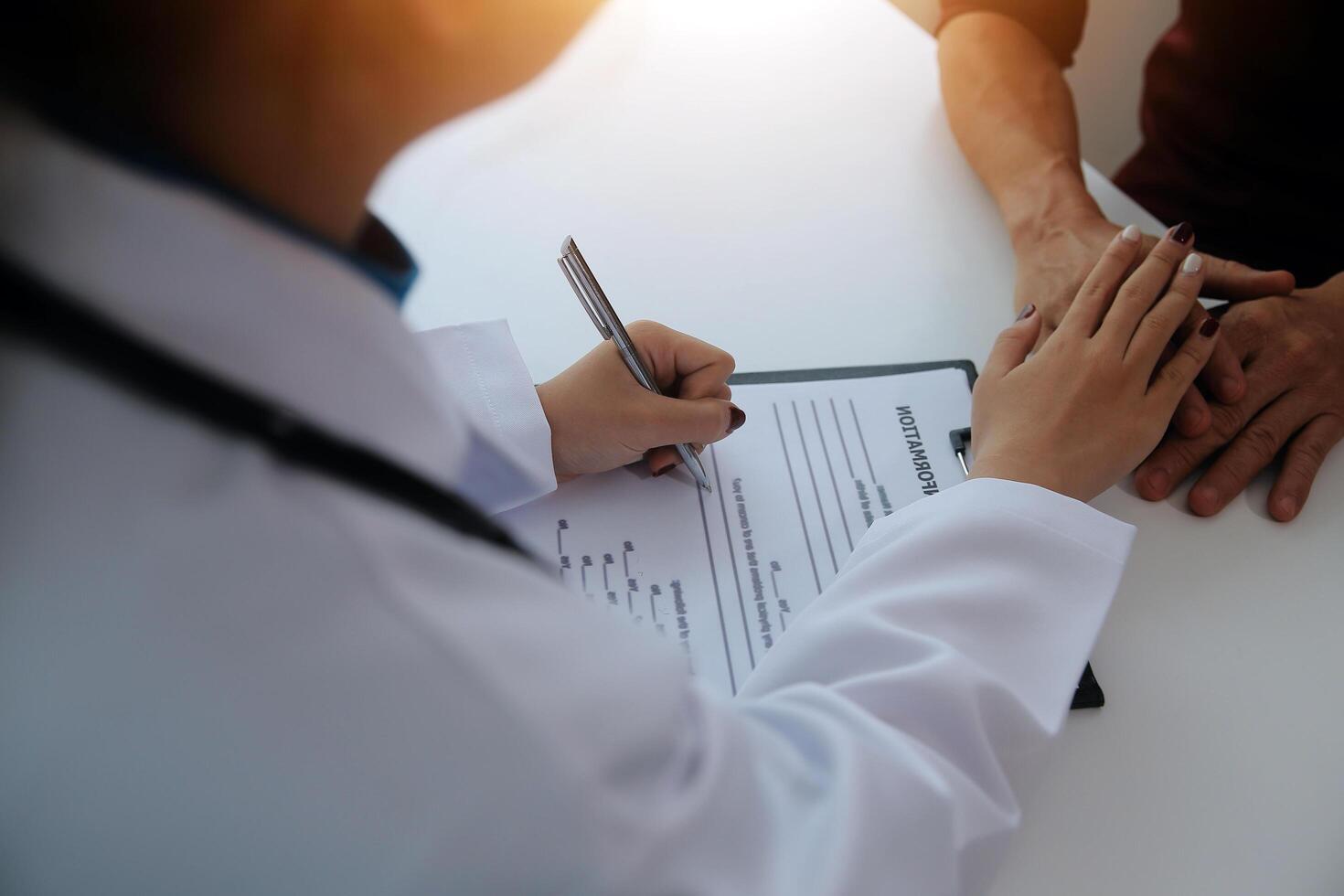 Female doctors shake hands with patients encouraging each other To offer love, concern, and encouragement while checking the patient's health. Concept Health care and Social Security photo