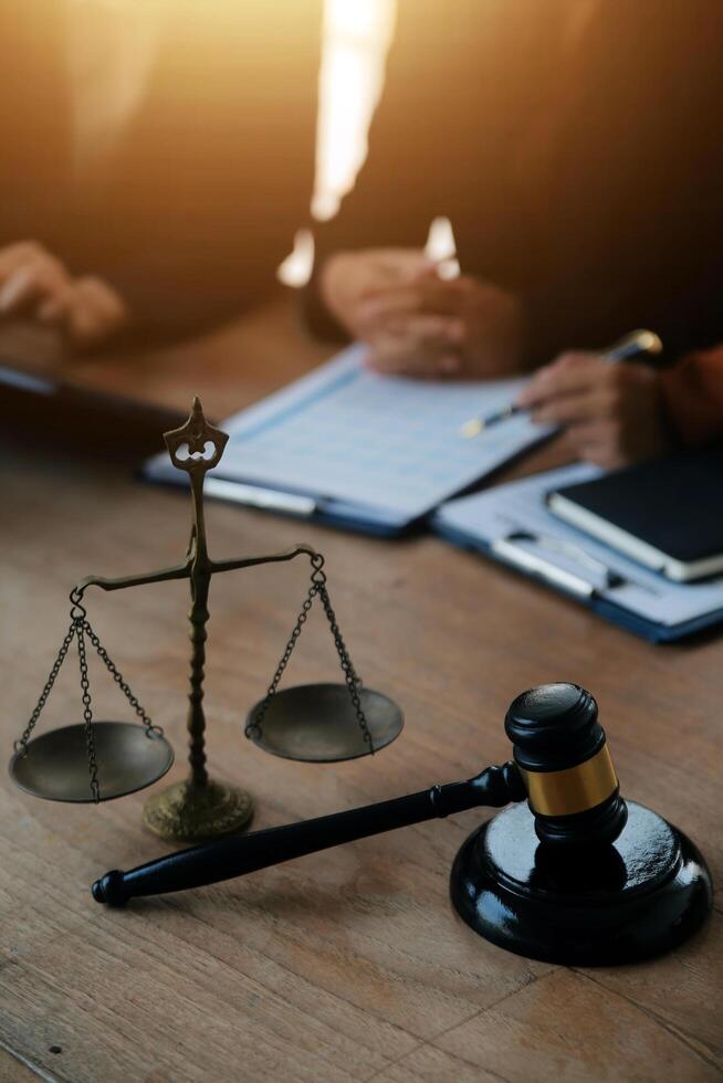 Lawyer, legal advisor, businessman brainstorming information on agreement details Business contracts in legal processing books for accuracy in contract documents. joint financial investment. photo