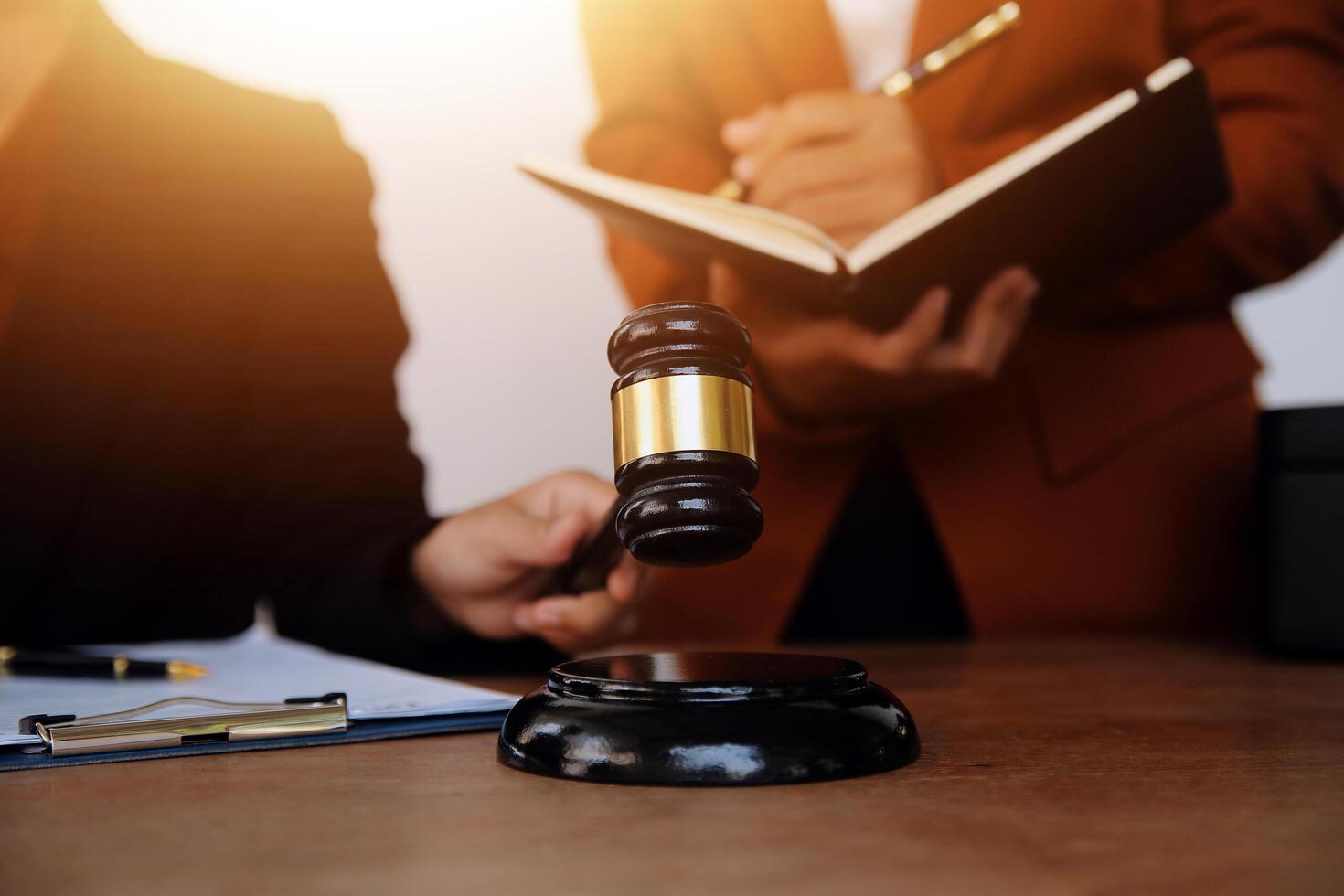 Lawyer, legal advisor, businessman brainstorming information on agreement details Business contracts in legal processing books for accuracy in contract documents. joint financial investment. photo