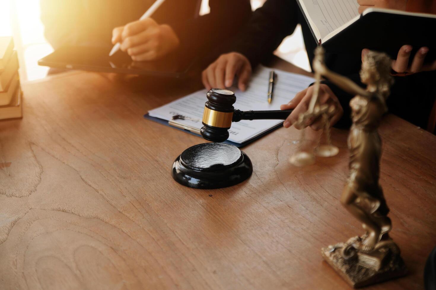 Lawyer, legal advisor, businessman brainstorming information on agreement details Business contracts in legal processing books for accuracy in contract documents. joint financial investment. photo