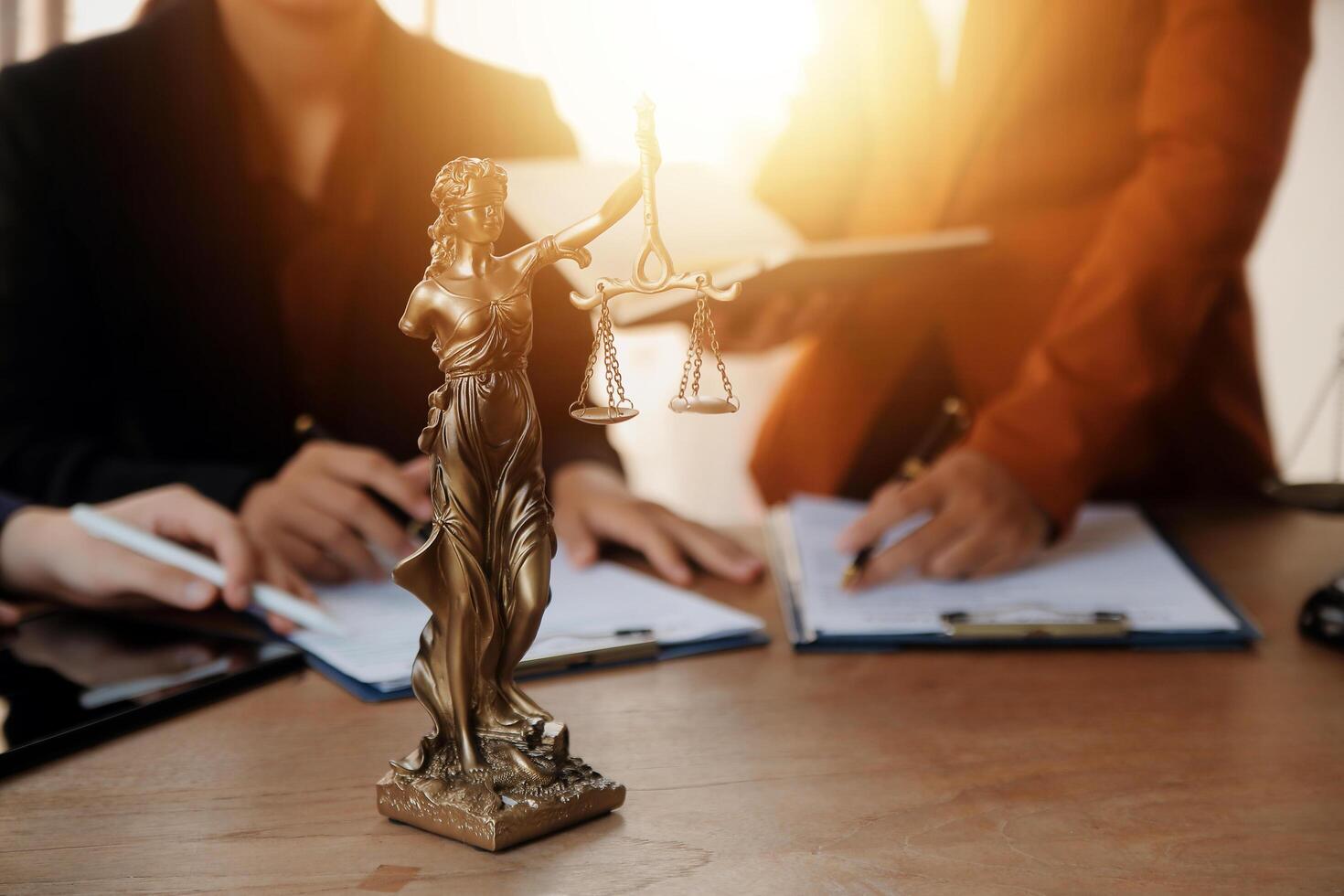 Lawyer, legal advisor, businessman brainstorming information on agreement details Business contracts in legal processing books for accuracy in contract documents. joint financial investment. photo