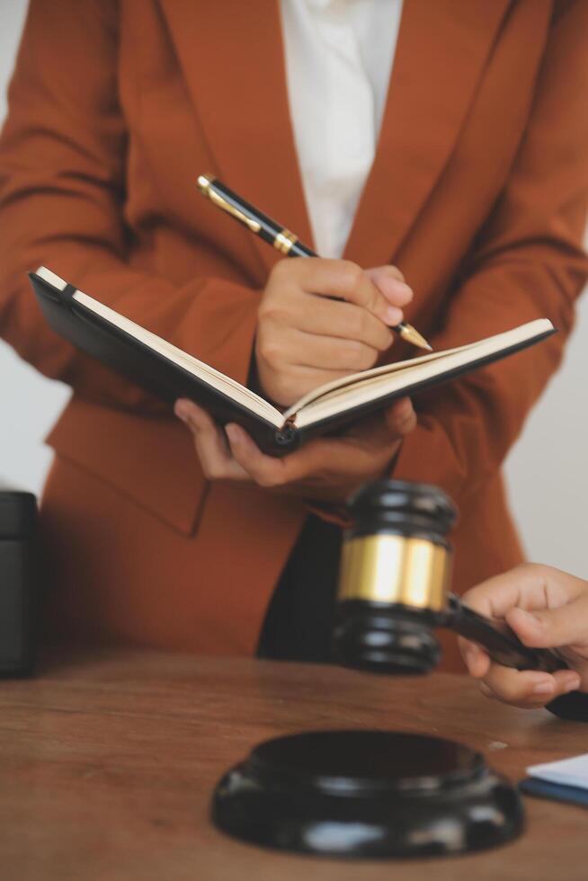 Lawyer, legal advisor, businessman brainstorming information on agreement details Business contracts in legal processing books for accuracy in contract documents. joint financial investment. photo