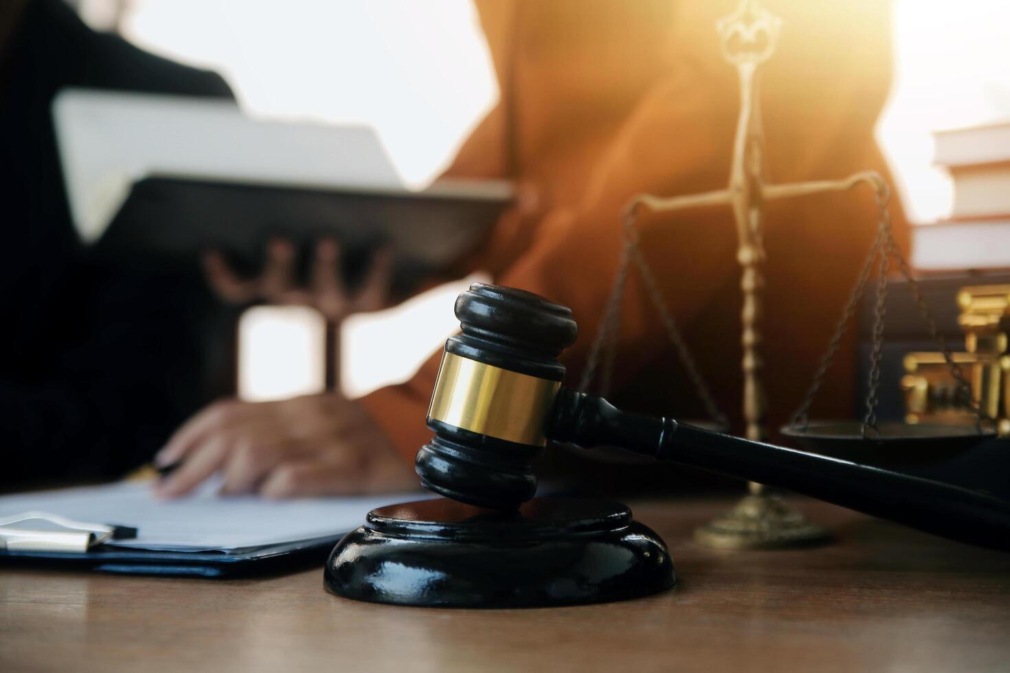 Lawyer, legal advisor, businessman brainstorming information on agreement details Business contracts in legal processing books for accuracy in contract documents. joint financial investment. photo