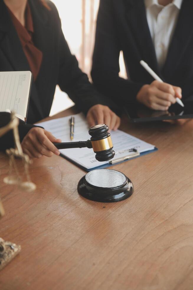 Lawyer, legal advisor, businessman brainstorming information on agreement details Business contracts in legal processing books for accuracy in contract documents. joint financial investment. photo