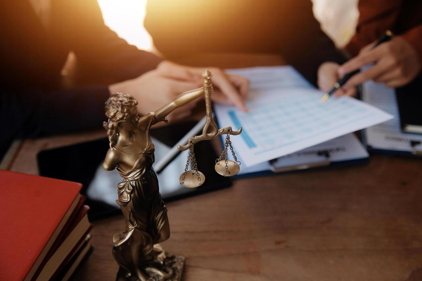 Lawyer, legal advisor, businessman brainstorming information on agreement details Business contracts in legal processing books for accuracy in contract documents. joint financial investment. photo