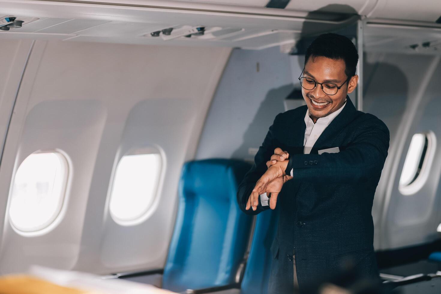 Going To Flight. Arab Businessman Walking With Suitcase In Airport And Looking At Wristwatch, Handsome Middle Eastern Male Traveller Checking Departure Time On Watch, Ready For Air Trip, Copy Space photo