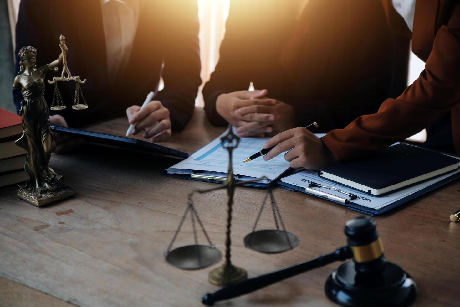 Lawyer, legal advisor, businessman brainstorming information on agreement details Business contracts in legal processing books for accuracy in contract documents. joint financial investment. photo