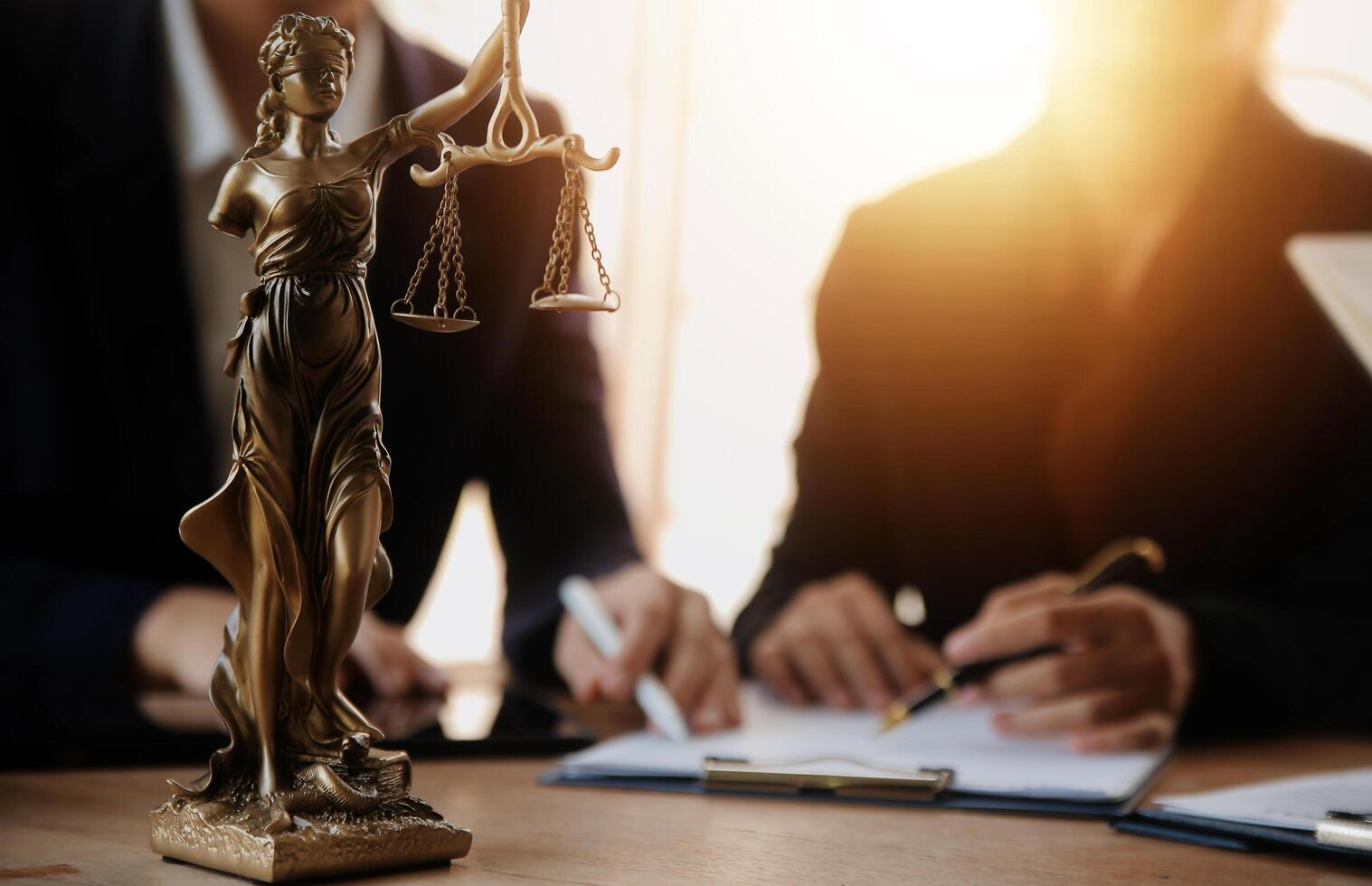 Lawyer, legal advisor, businessman brainstorming information on agreement details Business contracts in legal processing books for accuracy in contract documents. joint financial investment. photo
