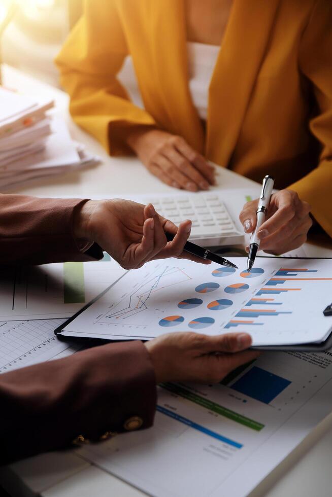 Team of business people working together in the meeting room office, teamwork background charts and graphs banner, double exposure successful teamwork,business planning concept. photo
