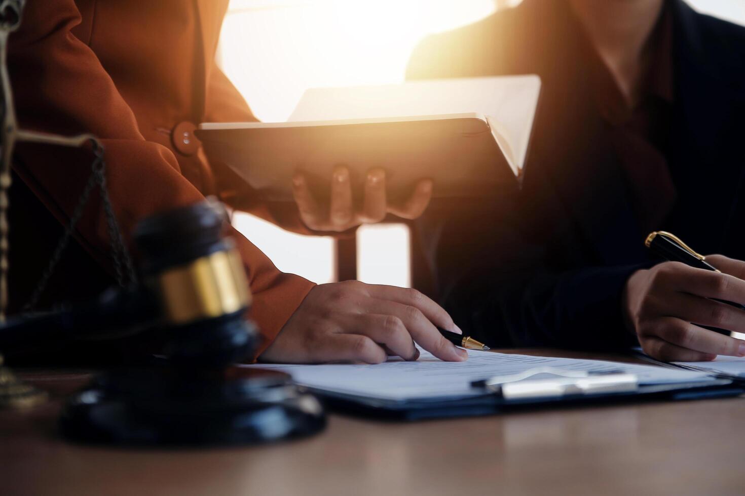 Lawyer, legal advisor, businessman brainstorming information on agreement details Business contracts in legal processing books for accuracy in contract documents. joint financial investment. photo