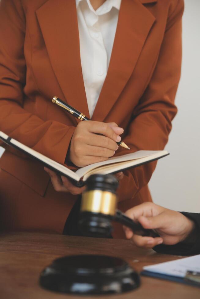 Lawyer, legal advisor, businessman brainstorming information on agreement details Business contracts in legal processing books for accuracy in contract documents. joint financial investment. photo
