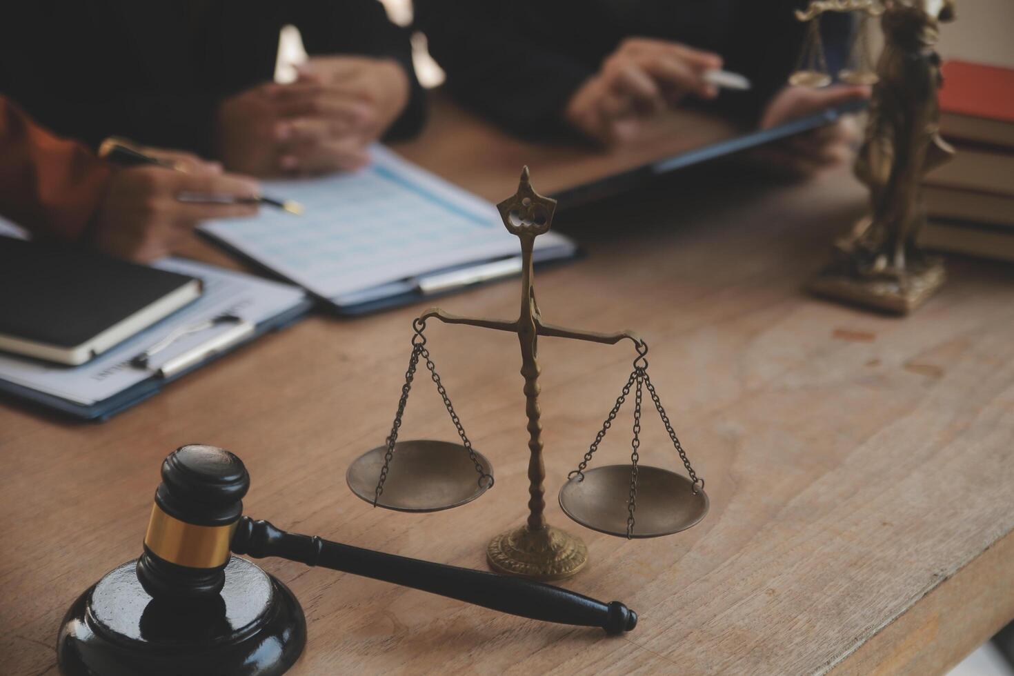 Lawyer, legal advisor, businessman brainstorming information on agreement details Business contracts in legal processing books for accuracy in contract documents. joint financial investment. photo