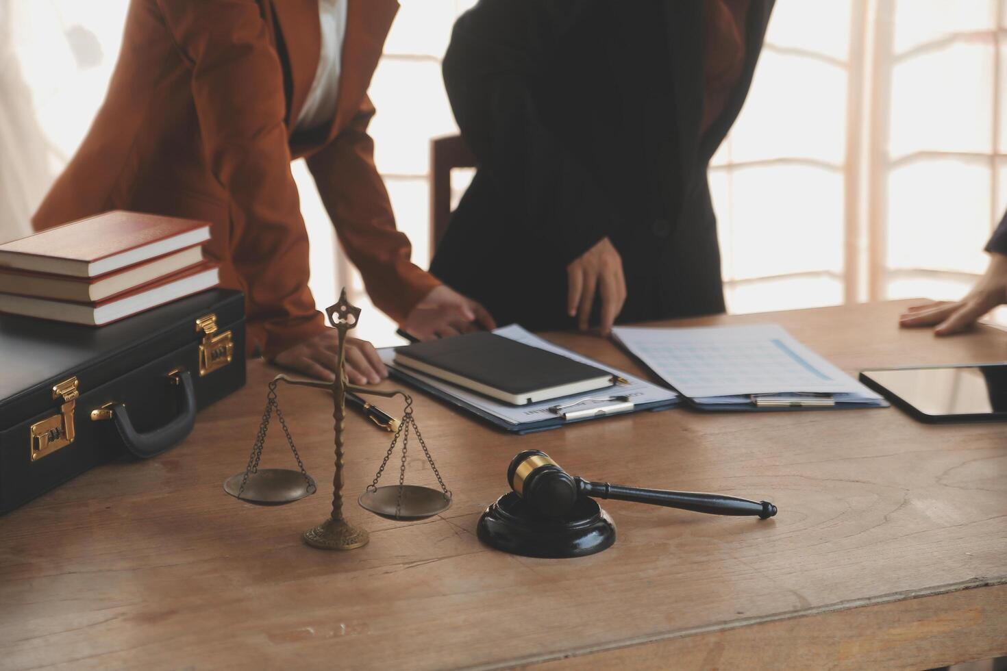 Lawyer, legal advisor, businessman brainstorming information on agreement details Business contracts in legal processing books for accuracy in contract documents. joint financial investment. photo